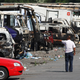 URUMQI, CHINA - JULY 09: Owners look for their cars which were damaged during the recent ethnic clashes at a parking place on July 9, Guang Niu/Getty Images